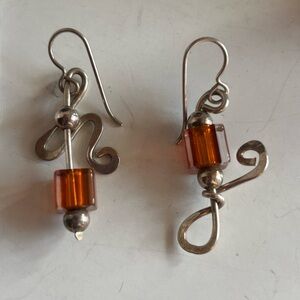 Artisan silver tone dangle pierced earrings.